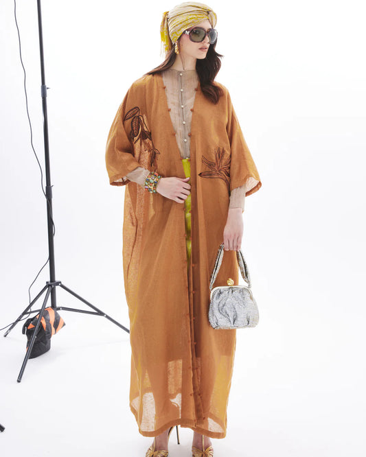MONOCHROME BIRD OF PARADISE ON RUST ABAYA