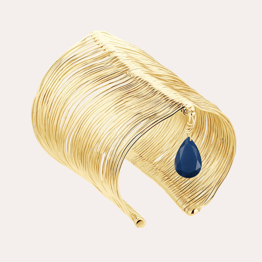 RIPPLE GOLD BANGLE WITH NAVY BLUE STONE